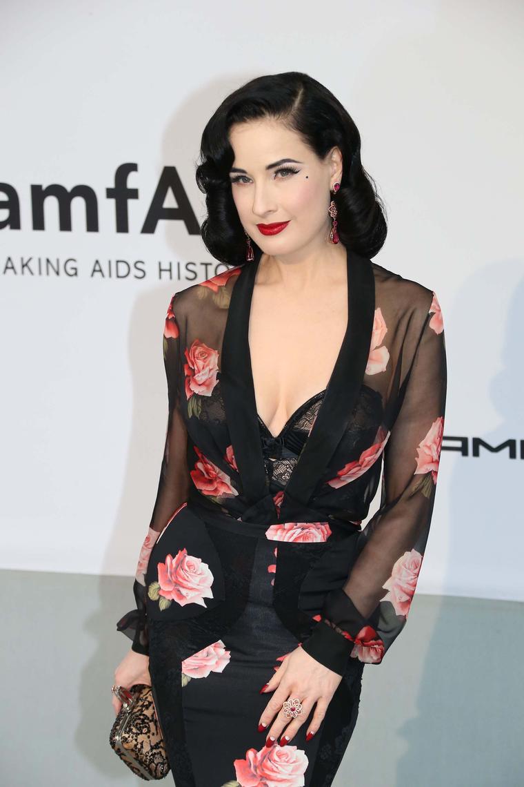 Dita Von Teese wore a pair of tourmaline and diamond earrings and a 5ct floral ruby ring, both by Chopard, to the amfAR Charity Gala in Cannes