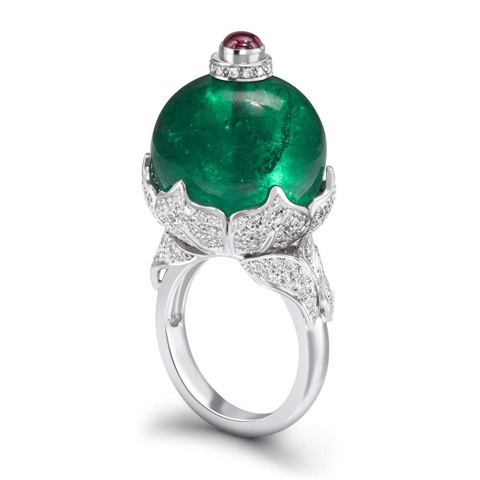 Theo Fennell white gold ring Theo Fennell white gold ring with a Gemfields emerald bead (38.70ct) surrounded by pavé diamonds and topped with a ruby. a Gemfields Emerald bead (38.70ct) surrounded by pavé diamonds and topped with a ruby.