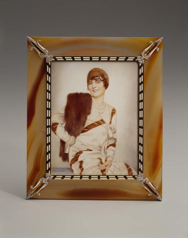 Cartier gold frame with agate, enamel, citrine quartz and diamonds displaying a photo of Marjorie Merriweather Post by C. Peitzner in watercolor on ivory. Image: Courtesy Hillwood Estate, Museum and Gardens