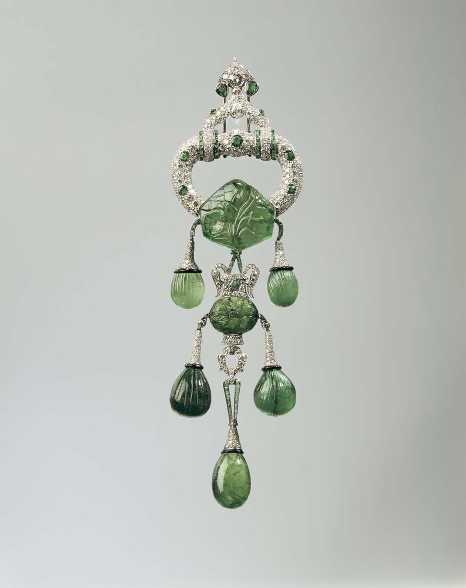 Cartier 1928 platinum pendant brooch with emeralds, diamonds and enamel. Image: Courtesy Hillwood Estate, Museum and Gardens.