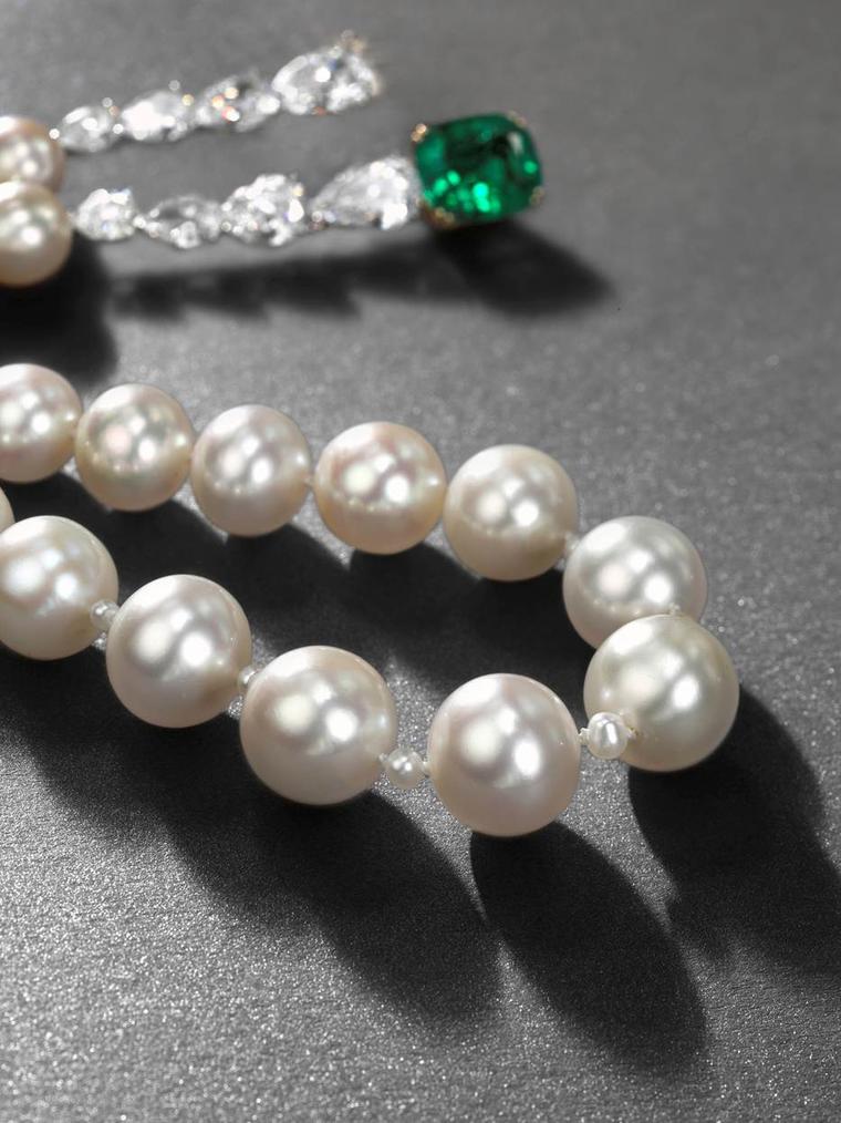 A rare natural pearl necklace with emeralds and diamonds, strung with 23 slightly graduated natural pearls, from Christie's Magnificent Jewels sale in Geneva in 2013, which set a new world record for a piece, selling for $8.5 million.