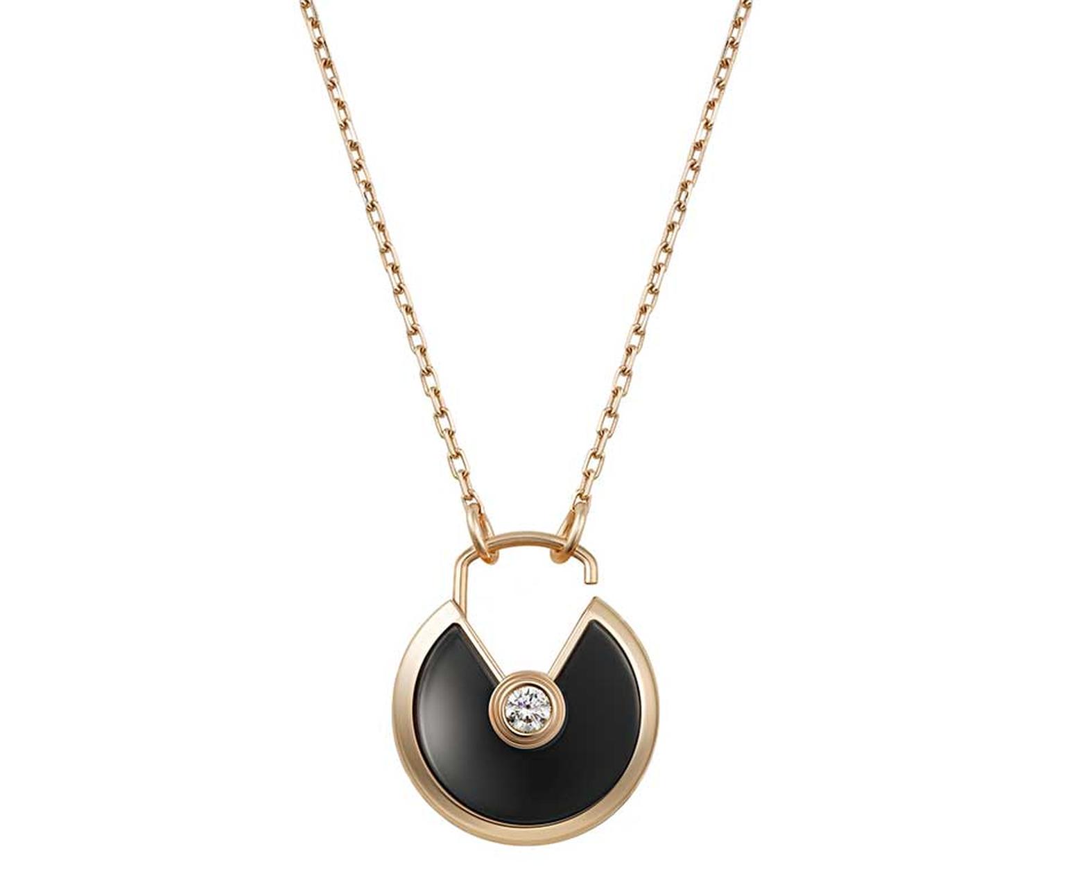 Amulette de Cartier pink gold pendant with onyx surrounding a brilliant-cut diamond