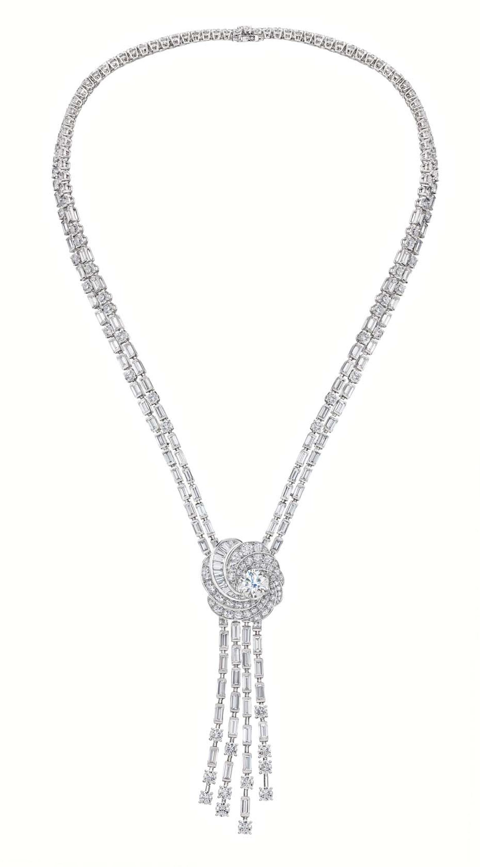 De Beers Aria high jewellery necklace in white gold featuring a swirling pendant set with brilliant and baguette-cut diamonds surrounding a brilliant-cut diamond.