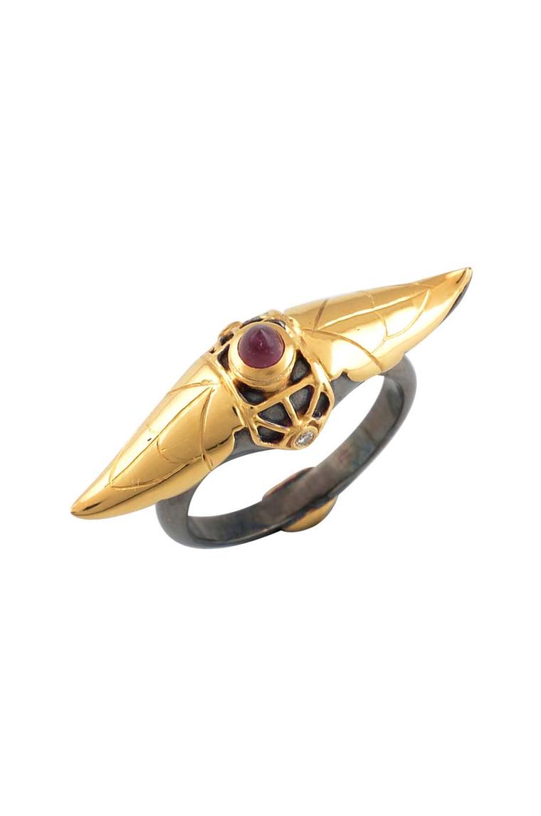Amrapali Dark Maharaja Dark Arch ring in silver and gold with a central ruby and diamonds.