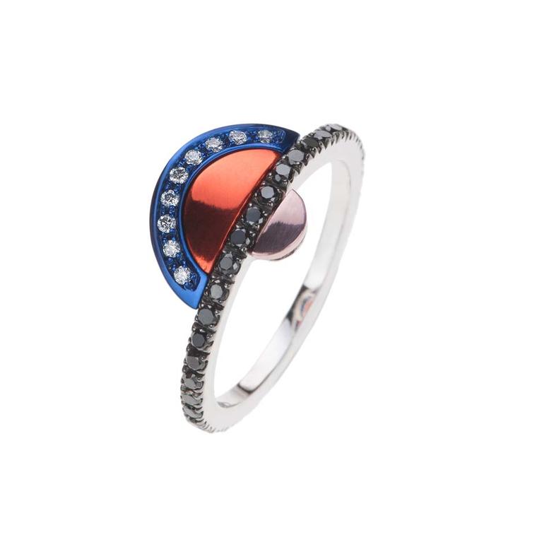 Nikos Koulis ring, from the new Acrobat collection, in black rhodium, with white and black diamonds and white gold hand-painted in blue, orange and pink.