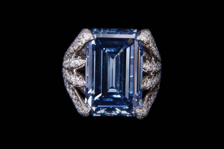 Verdura platinum Eight Blades ring featuring blue and white diamonds, set with a central 14.71ct emerald-cut blue diamond.