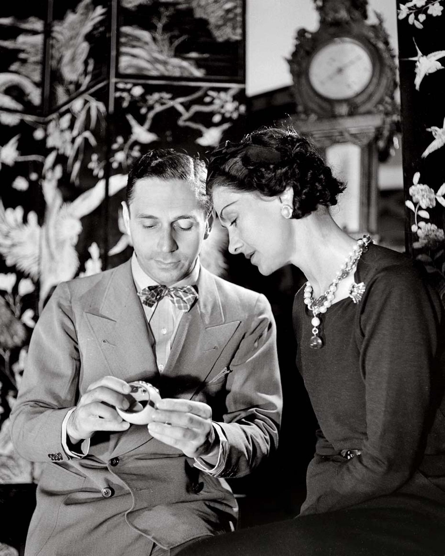 Duke Fulco di Verdura with Coco Chanel examining the signature Maltese cuffs he made for Ms Chanel.
