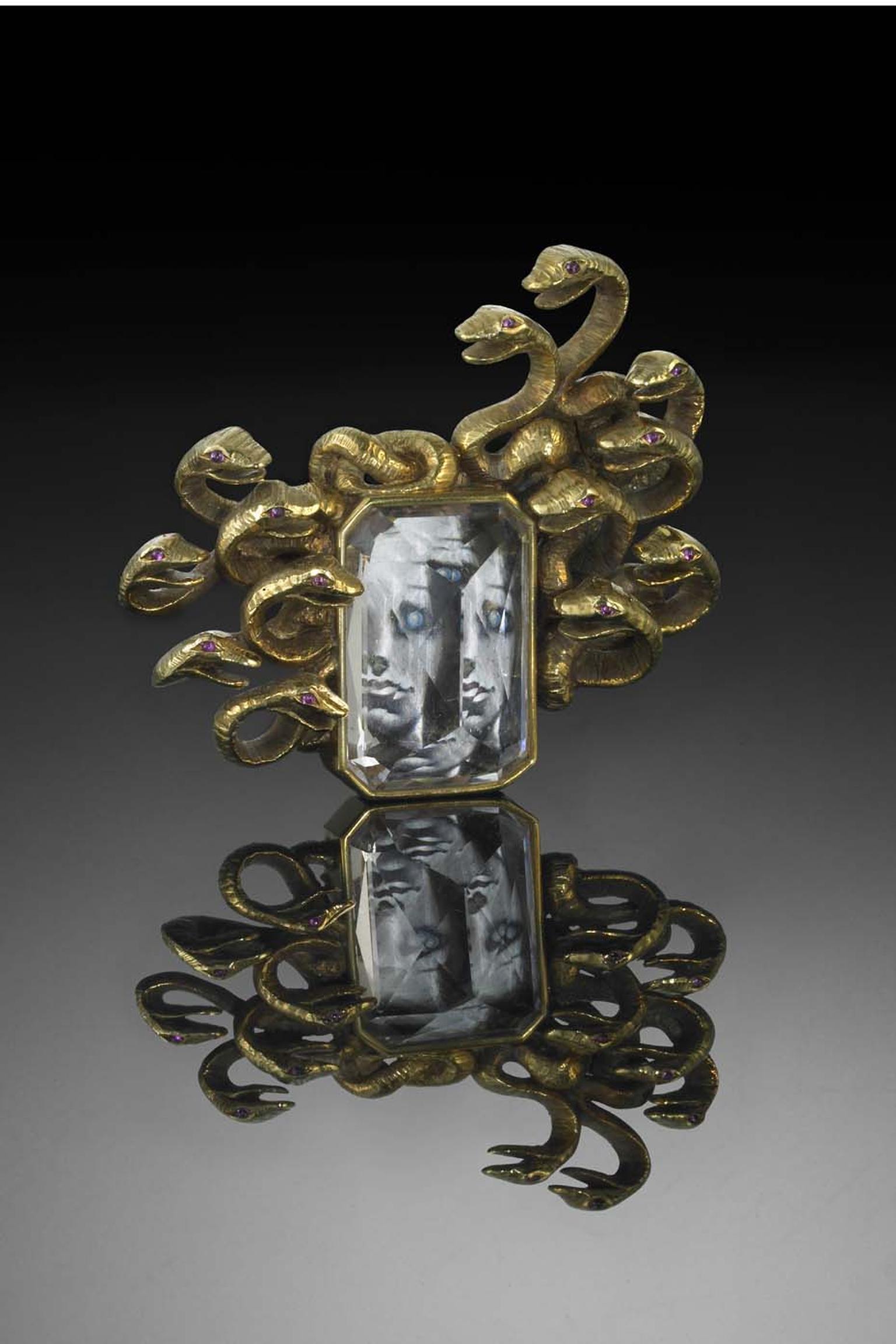 Verdura and Salvador Dali's 1941 Medusa collaboration: a gold, morganite and ruby brooch framing a miniature painting of Medusa.