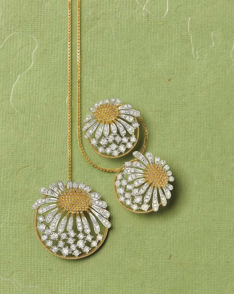 Tanishq Zyra collection white and yellow gold sunflower earrings and necklace studded with white diamonds.