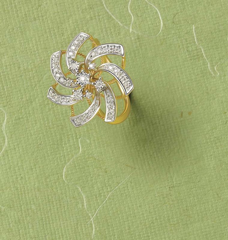 Tanishq Zyra collection white and yellow gold lily ring with white diamond petals surrounding scattered brilliant-cut diamonds.