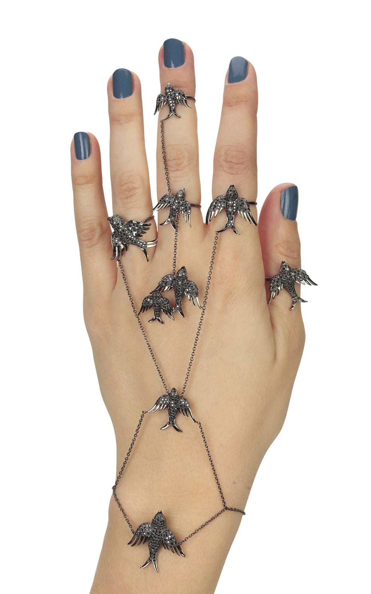 Colette Blue Drift black gold Installation of Birds hand jewel with black diamonds ($15,760).