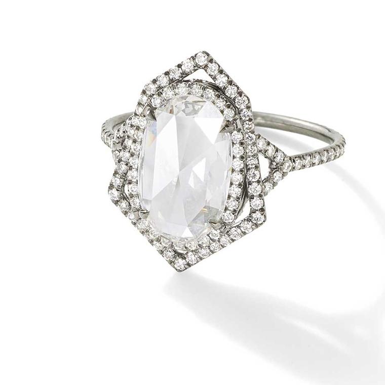 Monique Péan Mineraux engagement ring in recycled oxidised platinum, set with an antique white oval rose cut diamond and diamond pavé ($52,770).