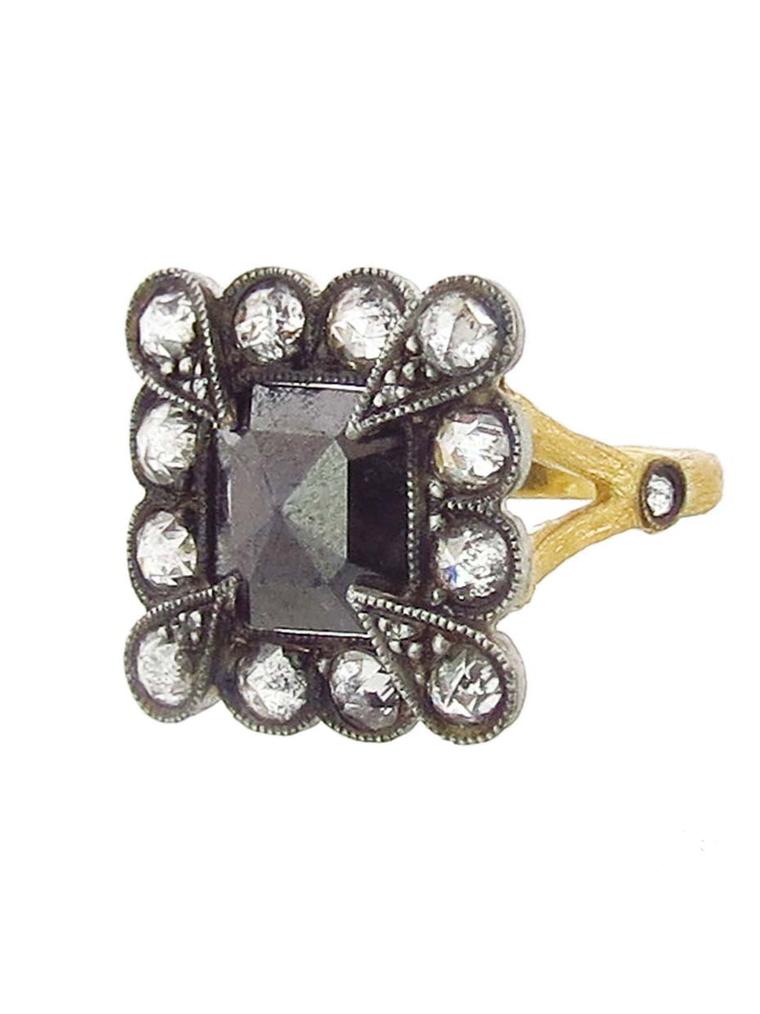 A one-of-a-kind Cathy Waterman black diamond Lace Edge ring featuring a 2.65ct diamond in a scalloped frame of white diamonds on her signature branch band in 22ct gold. Available at Ylang 23 (£5,355.18).