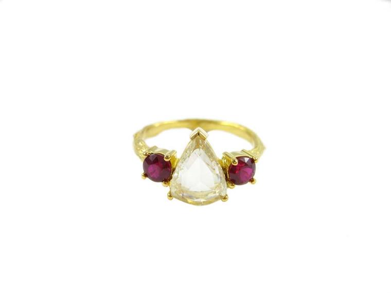 K Brunini Twig engagement ring featuring a centre pear-shaped diamond with two deep-red ruby side stones.