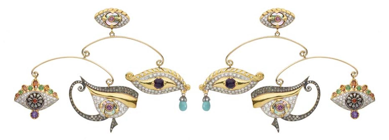 Sylvie Corbelin Fascination collection mobile earrings’ featuring three uniquely shaped gem-encrusted eyes suspended from a central stud, also in the shape of an eye.