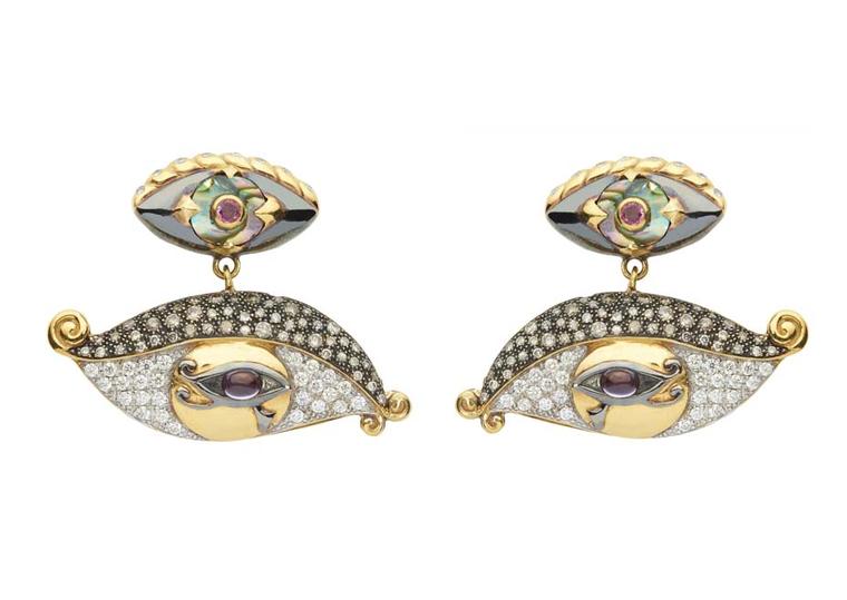 Sylvie Corbelin Fascination collection earrings featuring diamond and gem-encrusted eyes suspended from a central stud, also in the shape of an eye.