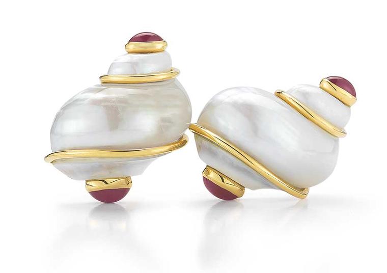 Seaman Schepps Turbo Shell earrings in yellow gold with rubies.