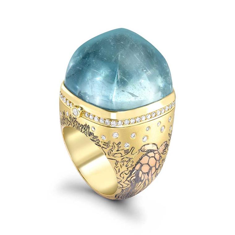 Theo Fennell Hermitage ring in yellow, rose and white gold, topped with a 64.53ct cabochon aquamarine. The ring opens to reveal a ruby-set crab.