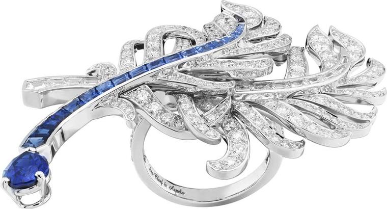 Van Cleef & Arpels Peau d'Ane Happy Marriage collection across-the-finger ring in white gold with round and baguette-cut diamonds, baguette-cut sapphires and one pear-shaped sapphire.