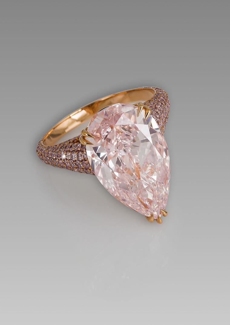 David Morris ring featuring a  pear shaped 8.06ct Fancy pink diamond surrounded by a band of pink diamonds.