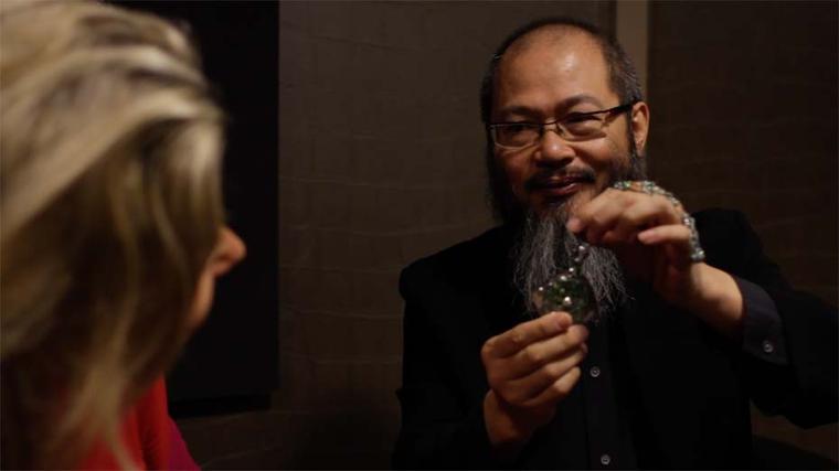 Wallace Chan shows Maria his Secret Abyss necklace featuring a 10.05ct yellow diamond, emeralds, fancy coloured diamonds and amethysts all safely nestled inside a 211.74ct rutilated quartz.