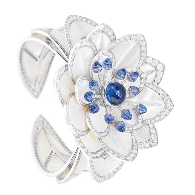 Boucheron Nymphea cuff featuring mother-of-pearl petals, sapphire cabochon pistils and  diamonds, from the Rêves d'Ailleurs high jewellery collection.