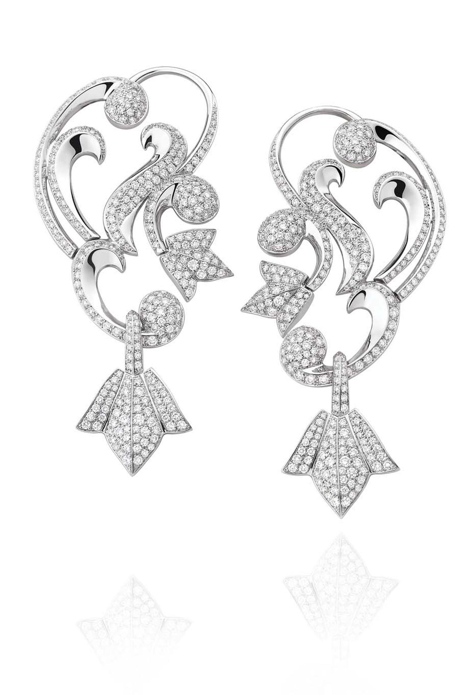 Mellerio dits Meller Secrets de Lys collection diamond ear cuffs in platinum, with swirling arabesques and lily motifs.