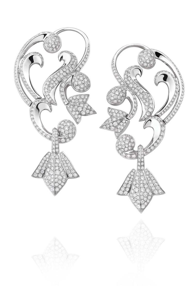 Mellerio dits Meller Secrets de Lys collection diamond ear cuffs in platinum, with swirling arabesques and lily motifs.