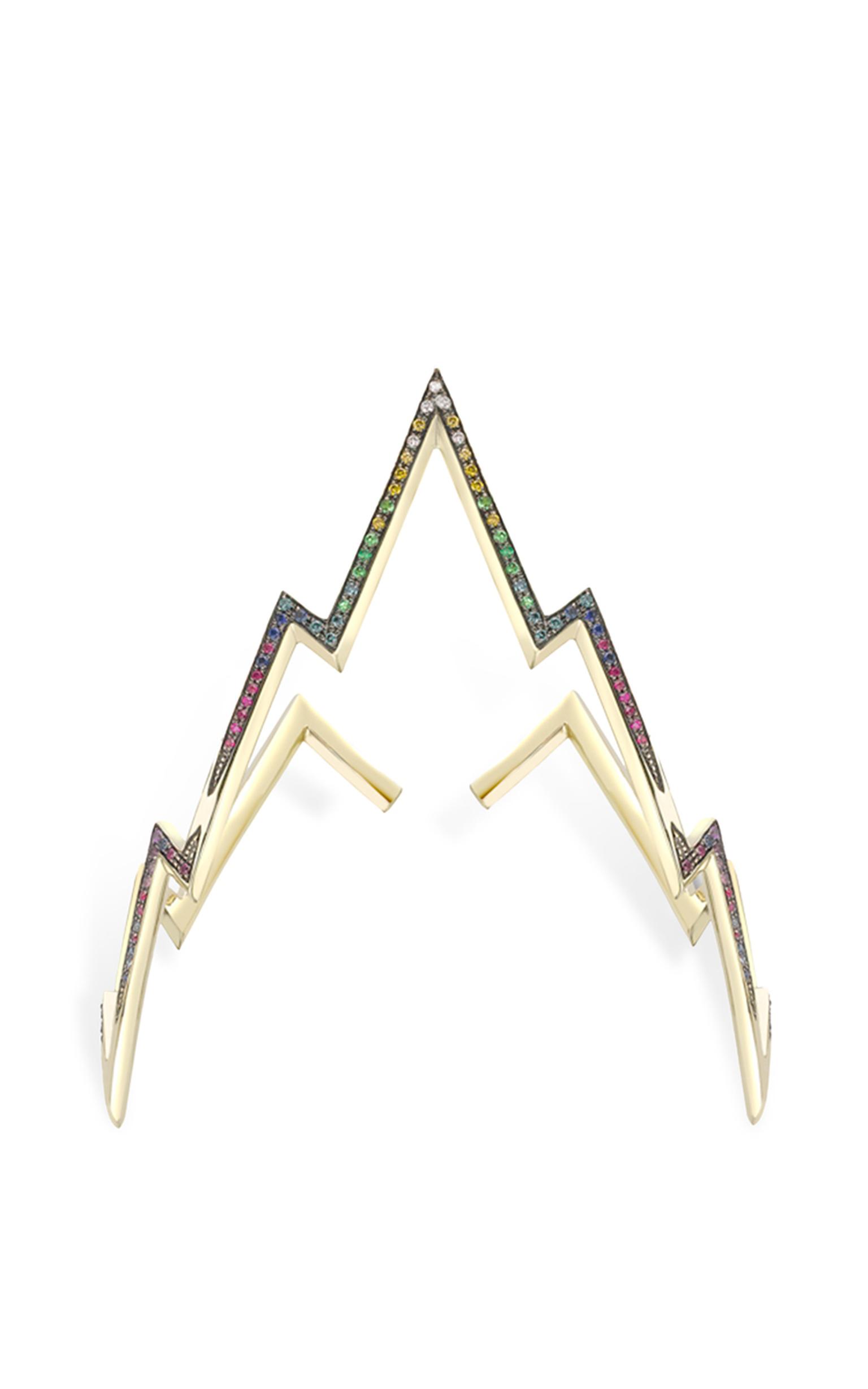 Venyx's Miss Zeus arm cuff features gold lightening bolts that wrap around the arm, encrusted with diamonds and coloured stones (available at modaoperandi.com).