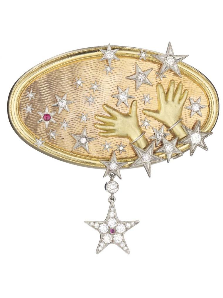 Anthony Lent's Hands to the Stars brooch features diamond-accented stars bursting from tiny hands that are fully realised, right down to the knuckle wrinkles and fingernails.