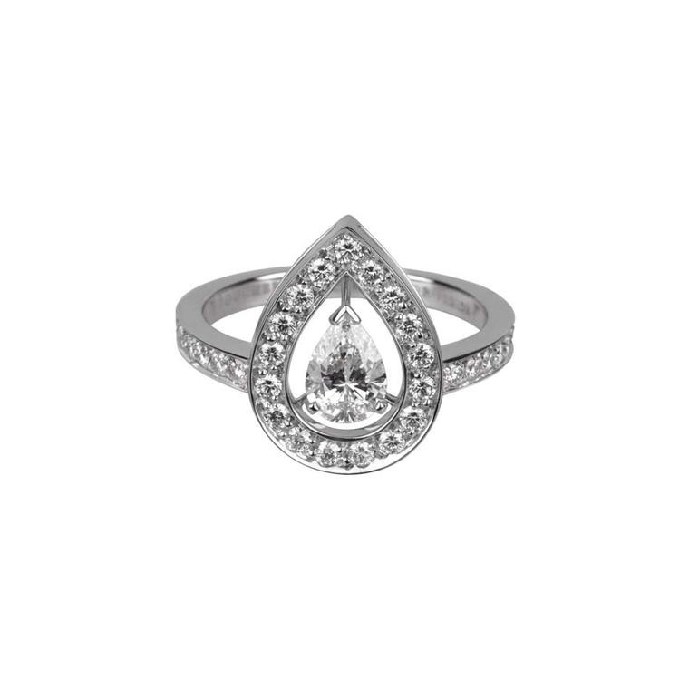 Boucheron Ava white gold engagement ring features a central pear-cut diamond that appears to float in mid-air amidst thirty-five round diamonds.