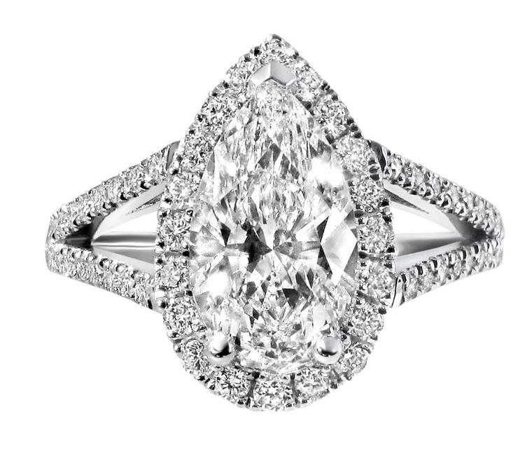 Ingle & Rhode's engagement ring features a central pear-cut Canadian diamond, surrounded by a halo of pavé diamonds.