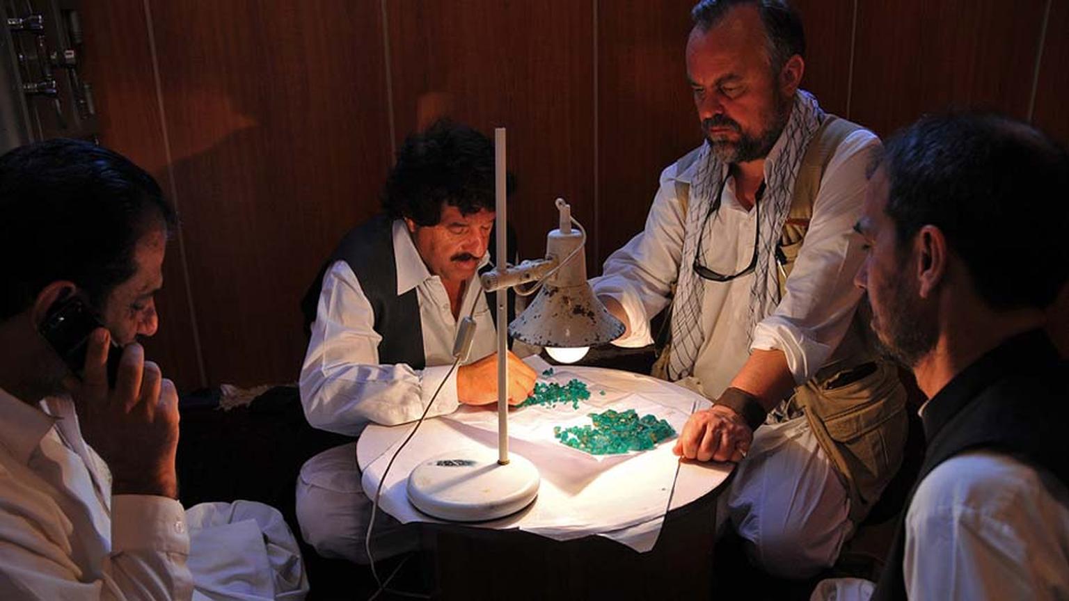 Guy on one of his gem hunting adventures, with an assortment of recently mined emeralds.