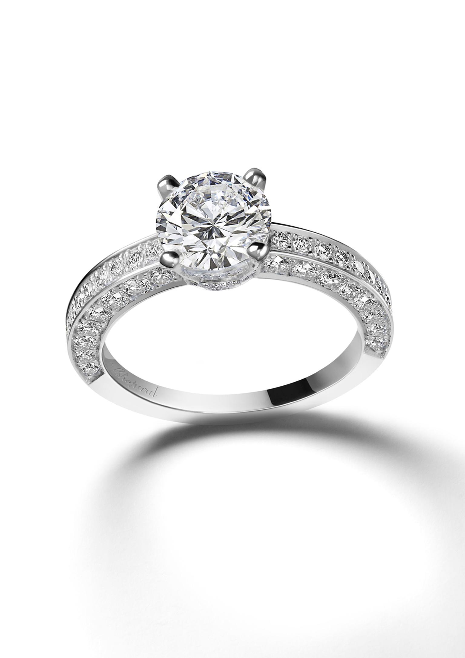 Chopard Passion for Happiness collection white gold solitaire diamond ring featuring an additional swath of diamonds along the tops and sides of the band.
