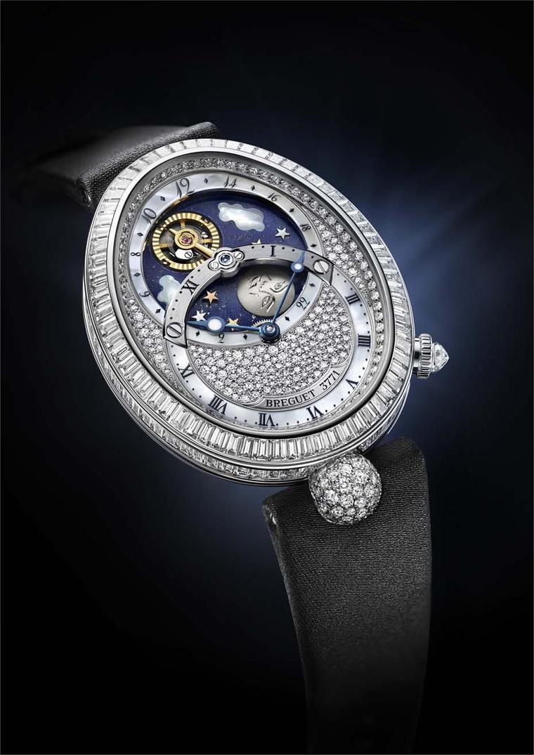 The lower dial of Breguet's Reine de Naples Jour/Nuit watch indicates the hours and minutes, while the upper dial enacts the daily transit of the Sun - represented by the golden tourbillion - as it rises and sets in a lapis lazuli sky, with a titanium Moo
