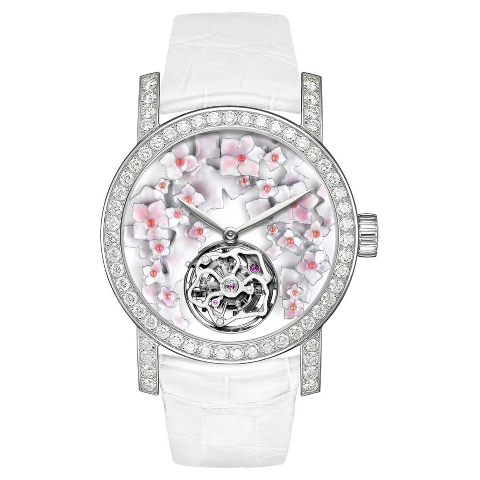 Chaumet's Hortensia Tourbillon watch features a round dial with a grand feu enamel background and hand-sculpted and engraved flowers, illuminated by diamonds on the bezel and lugs.