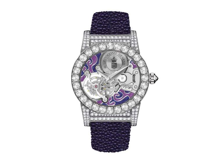 de GRISOGONO's Tondo Tourbillon Gioiello watch features a skeleton dial, with the tourbillon in full view enhanced by a swirly purple enamelled background. Large white diamonds decorate the oval-shaped case and lugs, which contrast with the hot purple gal