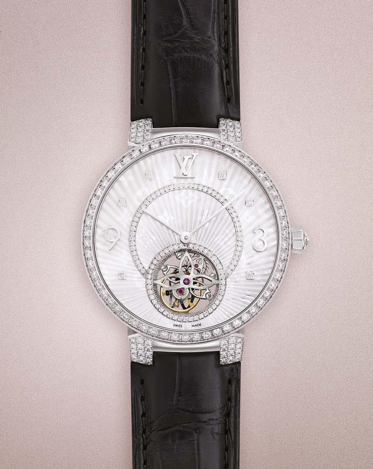 Louis Vuitton's Tambour Monogram watch features a pleated mother-of-pearl dial with diamonds, punctuated by a tourbillon that appears suspended in time, visible from both sides of the case.