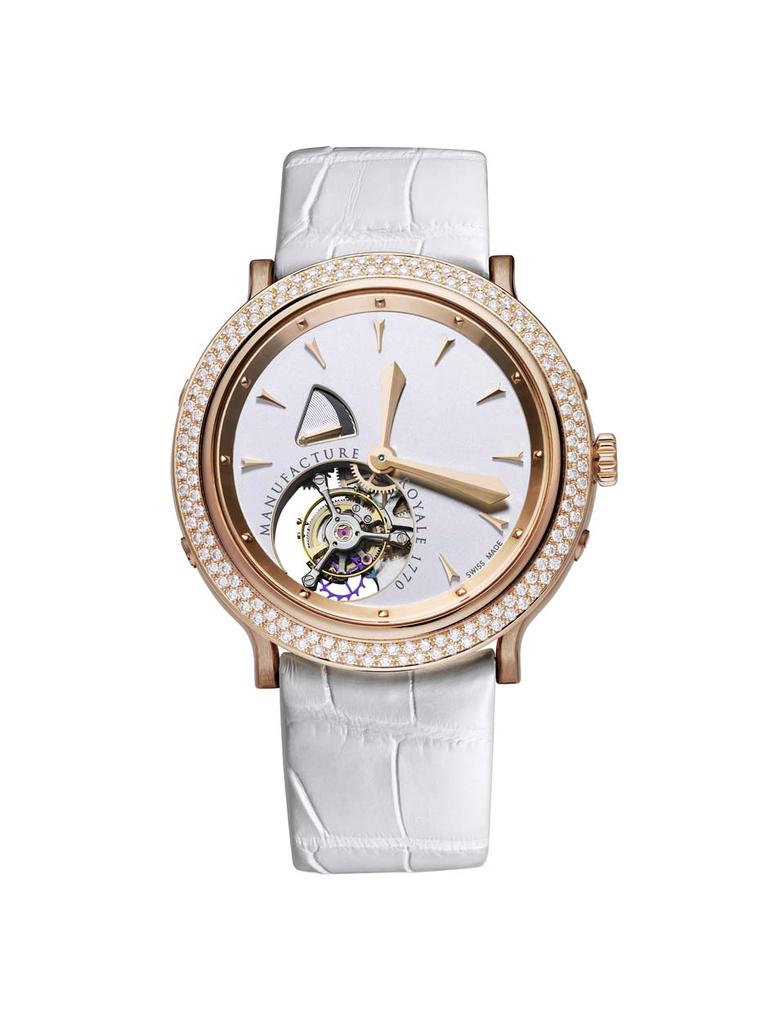 Manufacture Royale's 1770 Rose Gold & Diamonds watch features an in-house flying tourbillon positioned asymmetrically at 7 o'clock. The smooth opaline silvered dial, bereft of ornamentation - save for a small triangular aperture for the power reserve - al