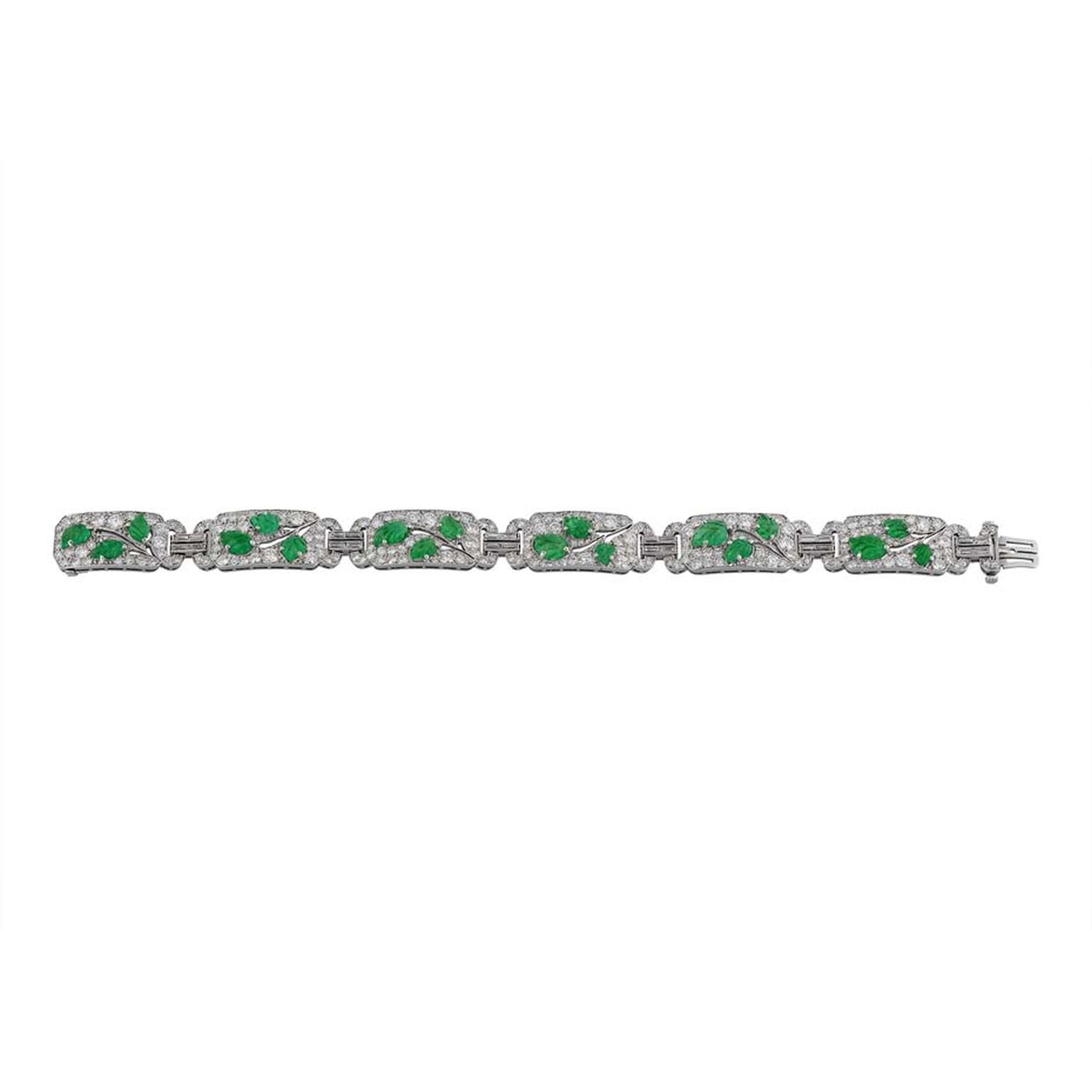 Morelle Davidson vintage Cartier bracelet in platinum with six diamond-pavéd openwork sections, each with three carved emerald leaves forming a branch with baguette diamond-set double links.