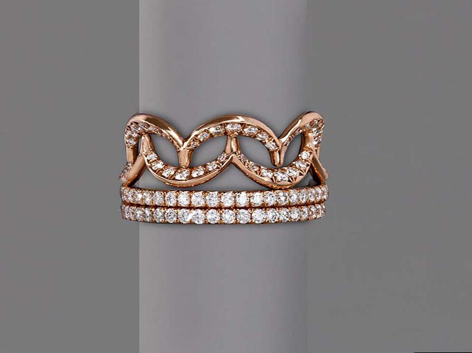 Jado Crown collection interlocking ring in gold with diamonds.