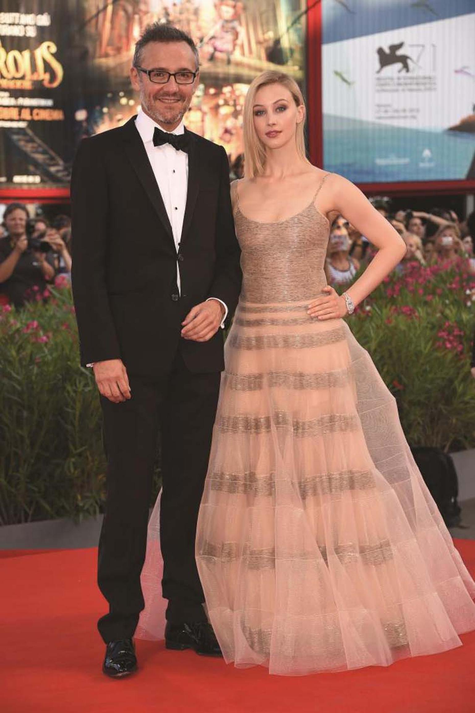 Jaeger-LeCoultre Communication Director Laurent Vinay and actress Sarah Gadon wearing the Jaeger-LeCoultre Reverso Cordonnet watch during the Venice Film Festival.