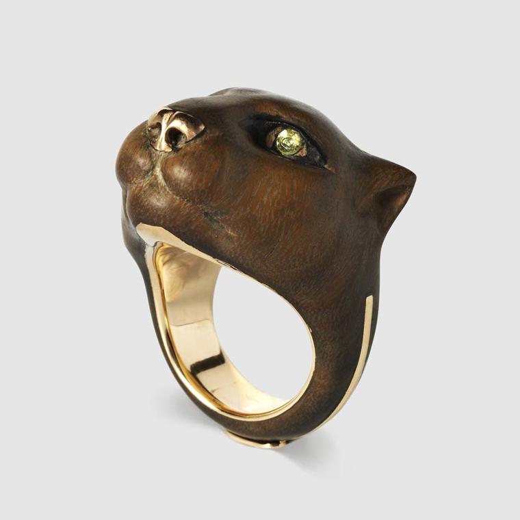 Harumi Klossowska de Rola wood and ebony Puma ring with two peridot eyes. Available exclusively from Dover Street Market.