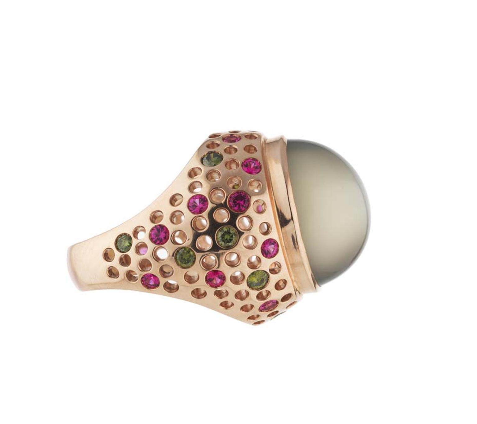 Holts Vivienne moonstone ring featuring a rose gold band studded with natural pink spinels and green diamonds.