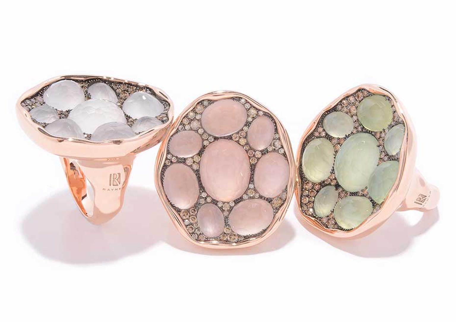 Rodney Rayner red gold rings featuring, from left to right, white quartz, rose quartz and prehnites surrounded by a sprinkling of diamonds.