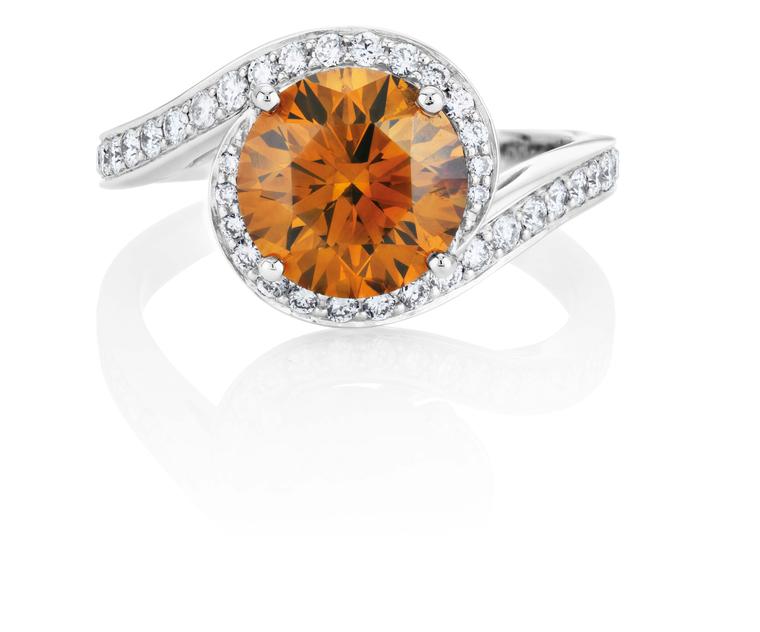 De Beers 1888 Master Diamonds Caress ring, set with a 2.53ct round brilliant Fancy deep brown-orange diamond.