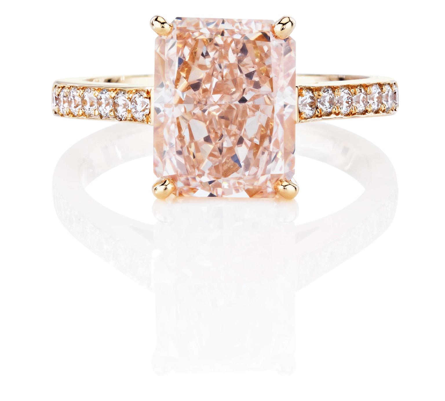 De Beers 1888 Master Diamonds DB Classic ring, set with a Radiant fancy pink diamond with a pavé diamond set band.