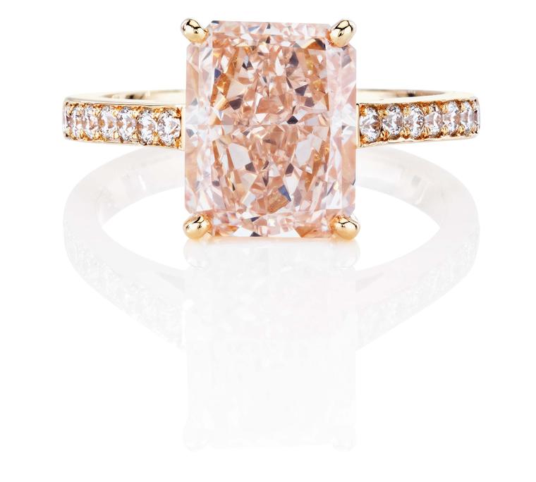 De Beers 1888 Master Diamonds DB Classic ring, set with a Radiant fancy pink diamond with a pavé diamond set band.