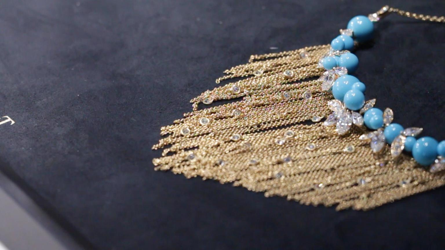 Extremely Piaget necklace with interspersed brilliant-cut diamonds amongst gold tassels hanging from turquoise beads and pear-shaped diamonds.