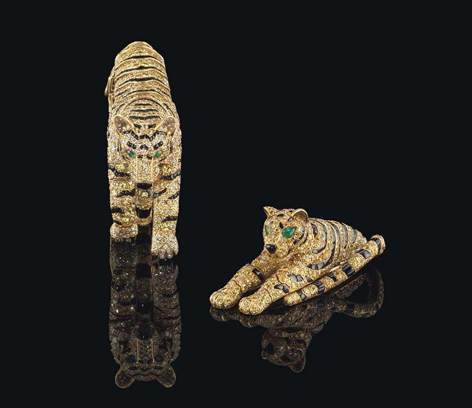 The Cartier Tiger bracelet and clip brooch, with diamonds, onyx and emeralds, which once belonged to the Duchess of Windsor and Sarah Brightman, are being sold as one lot at Christie's Magnificent Jewels auction on 11 November 2014 with a combined pre-sal
